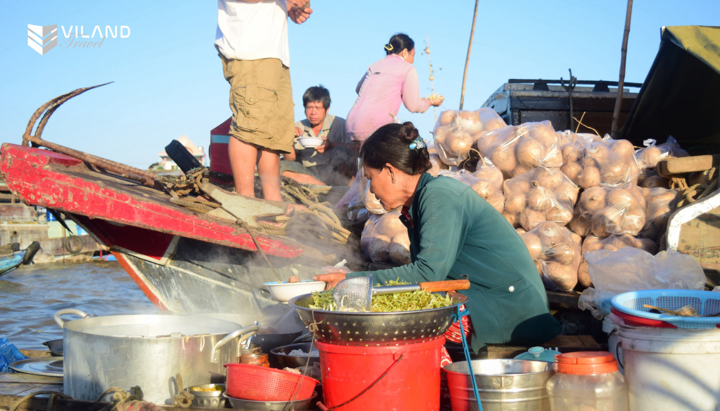 Mekong delta food vendor on floating market